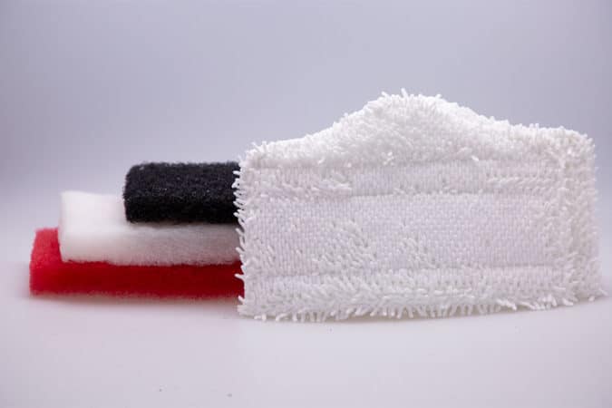 The Simple Scrub series Cleaning Combo Package with a red, white, black, and microfiber towel cleaning pads.
