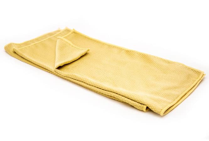 A stack of three heavy duty yellow microfiber cloths available for purchase on the Simple Scrub website.