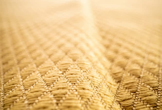 A close up view of the toughest yellow microfiber cloth offered by The Simple Scrub.