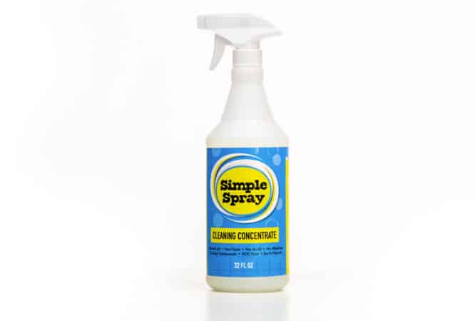A 32 fluid oz bottle of the Simple Spray Multipurpose Cleaning Concentrate by The Simple Scrub.