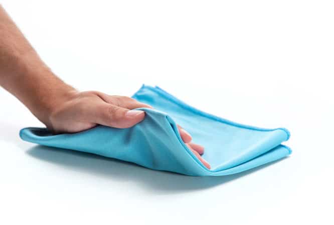 A soft light blue microfiber polishing cloth available for purchase on The Simple Scrub website.