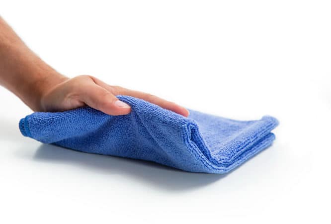 An absorbent dark blue microfiber cloth available for purchase on The Simple Scrub website.