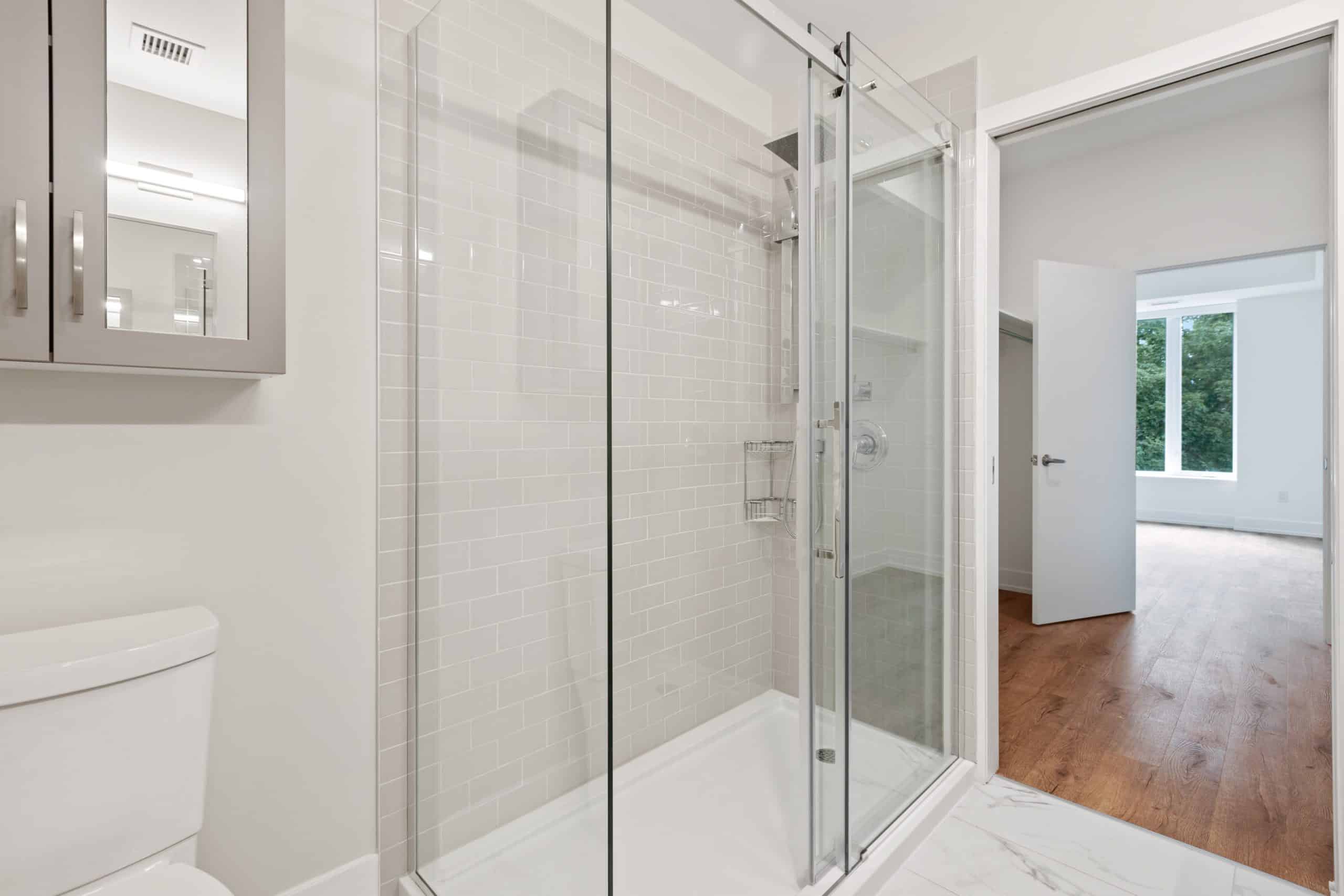 A clean, streak-free glass shower door awaits its next use